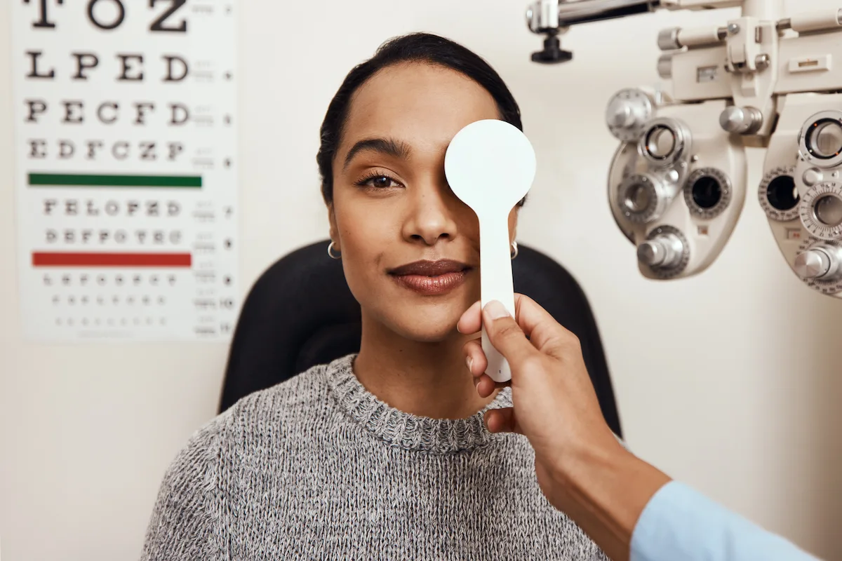 Woman receiving eye exam at optometrist office